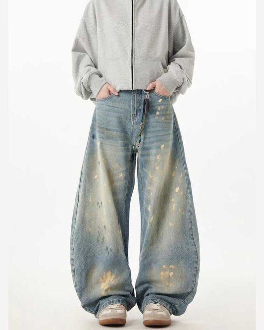 Jean en denim à jambes larges et incurvées, coupe tonneau, éclaboussures dorées peintes à la main