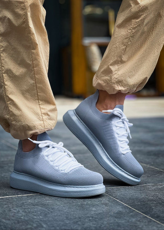 Light grey knit Torino Grey Peak sneakers with white laces and cushioned sole.