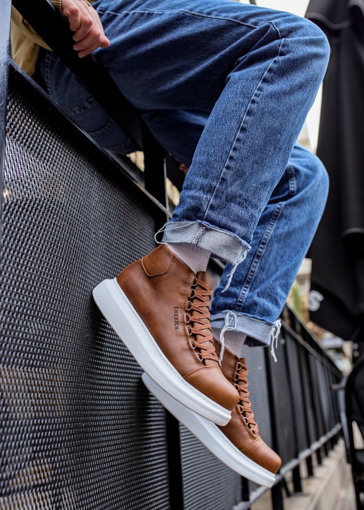 Kelly Rustic Rendezvous high-top boot in brown by Apollo Moda, worn on a staircase